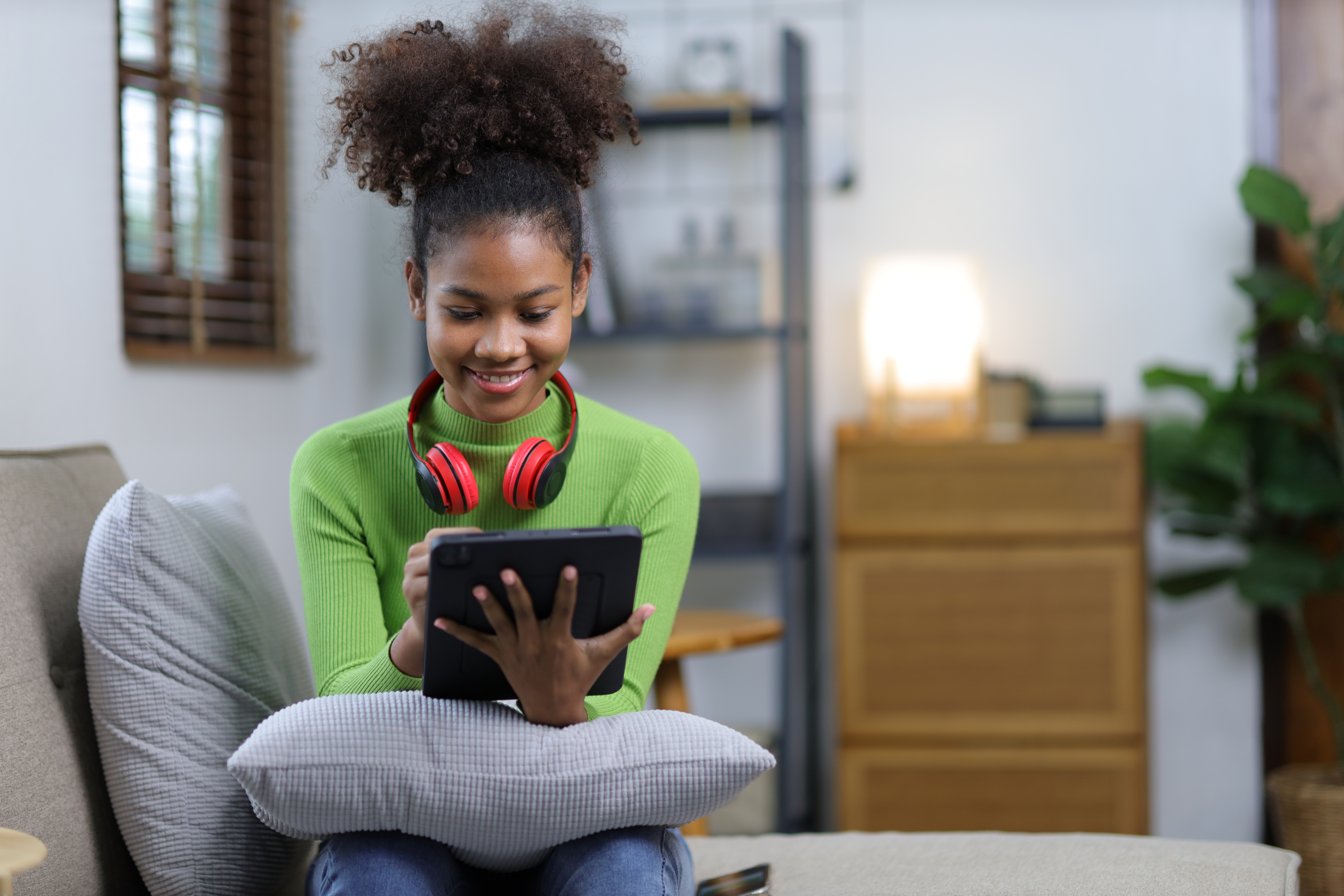 young girl looking at iPad