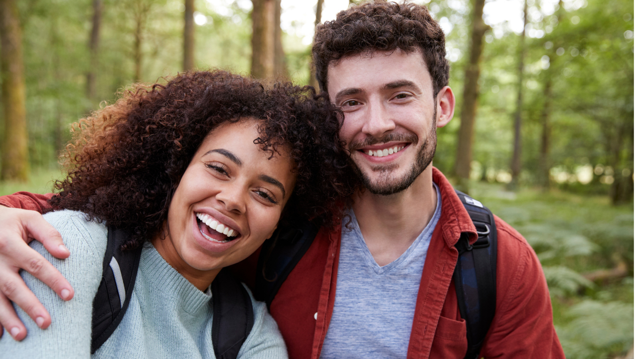 young couple outside hiking